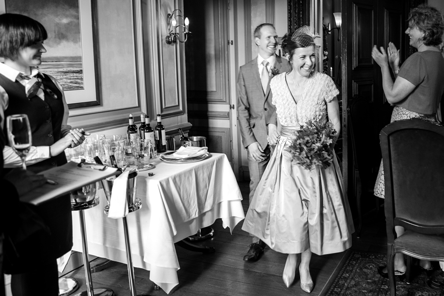 Bride and groom entering the reception room at Cringletie House wedding celebrations