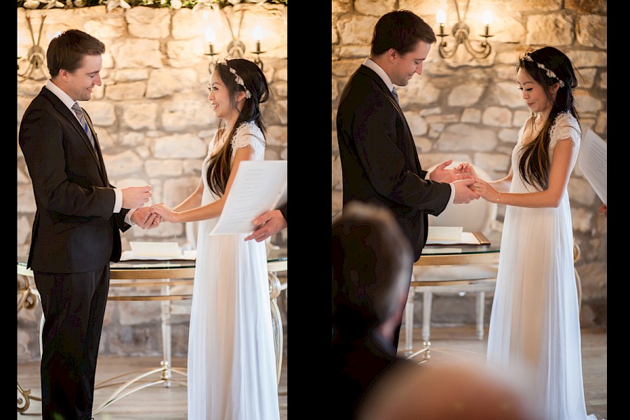 Bride and groom exchanging rings at the wedding ceremony at Harburn House