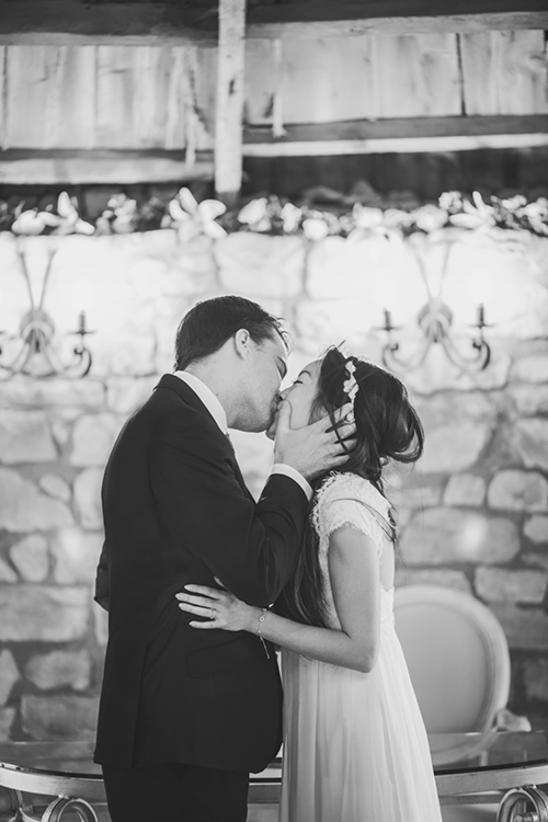 Bride and groom kiss at Harburn House wedding ceremony