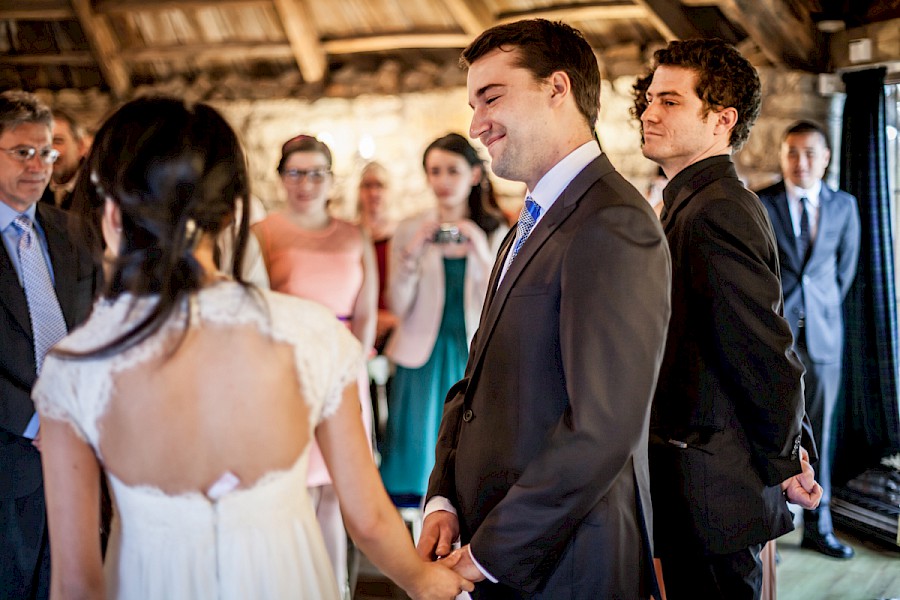 Groom looking at his bride during the ceremony at Harburn House