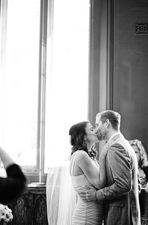 Groom kissing his bride