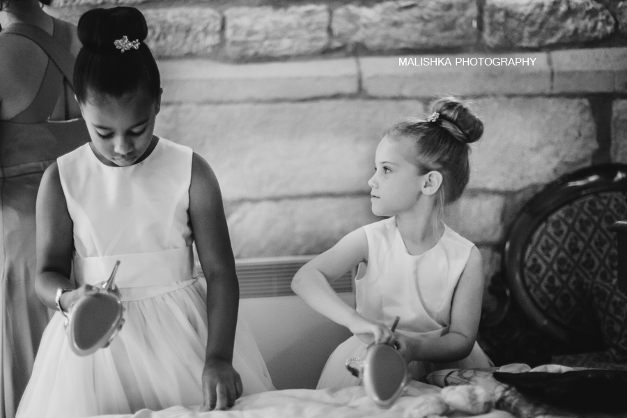 Little bridesmaids helping the bride at Dalhousie Castle in Edinburgh