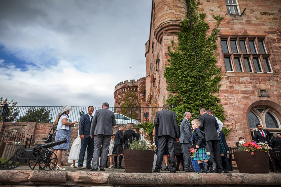 Wedding guests at the balcony of Dalhousie Castle