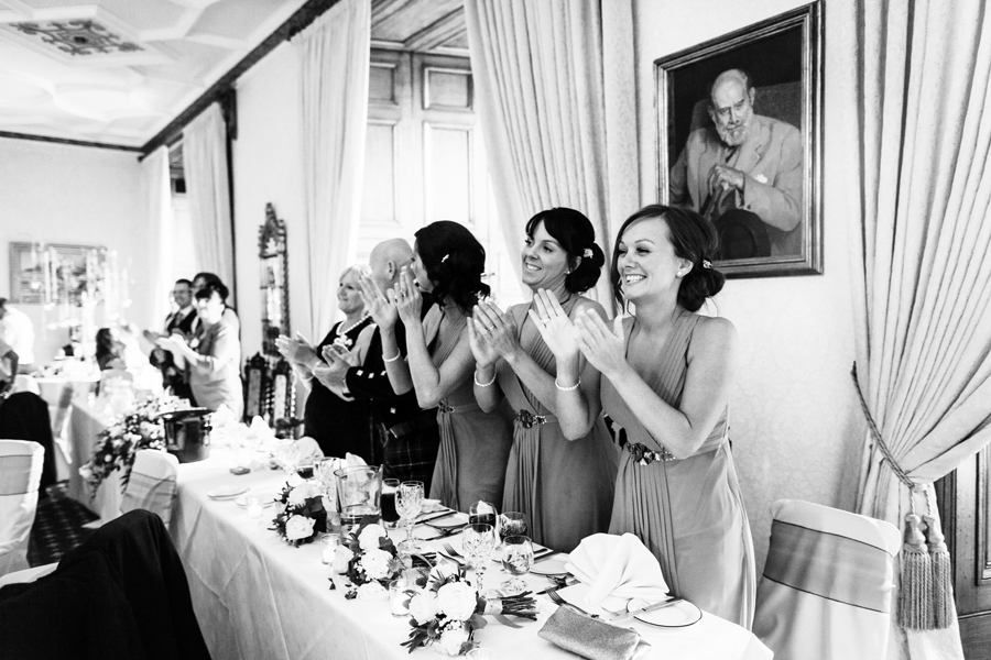 Bridesmaids cheering for the couple entrance at Dalhousie Castle wedding