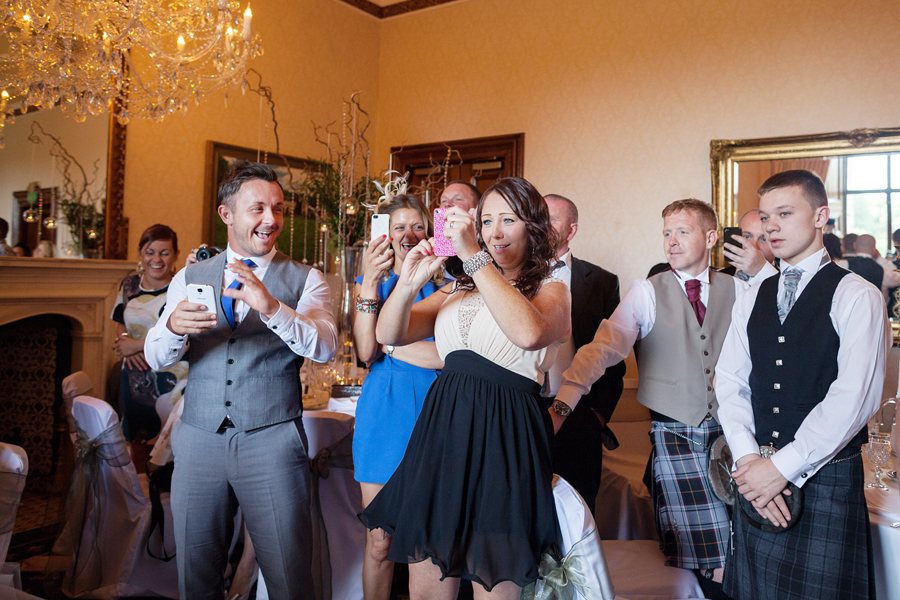 Scotland wedding photographer capturing wedding guests at Dalhousie Castle