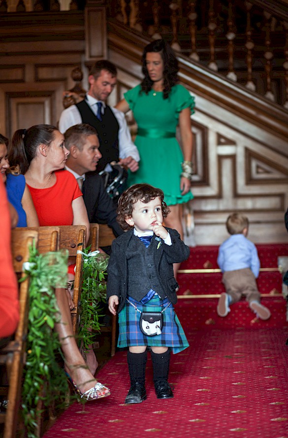 Cute page boy in kilt before the wedding ceremony at Dalhousie Castle