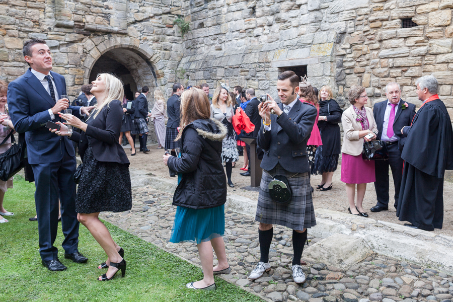 Wedding guests having fun on Inchcolm Island during the wedding photography