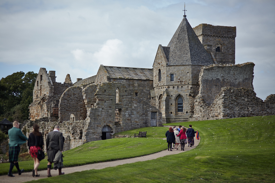 Wedding guests walking to Inchcolm Abbey