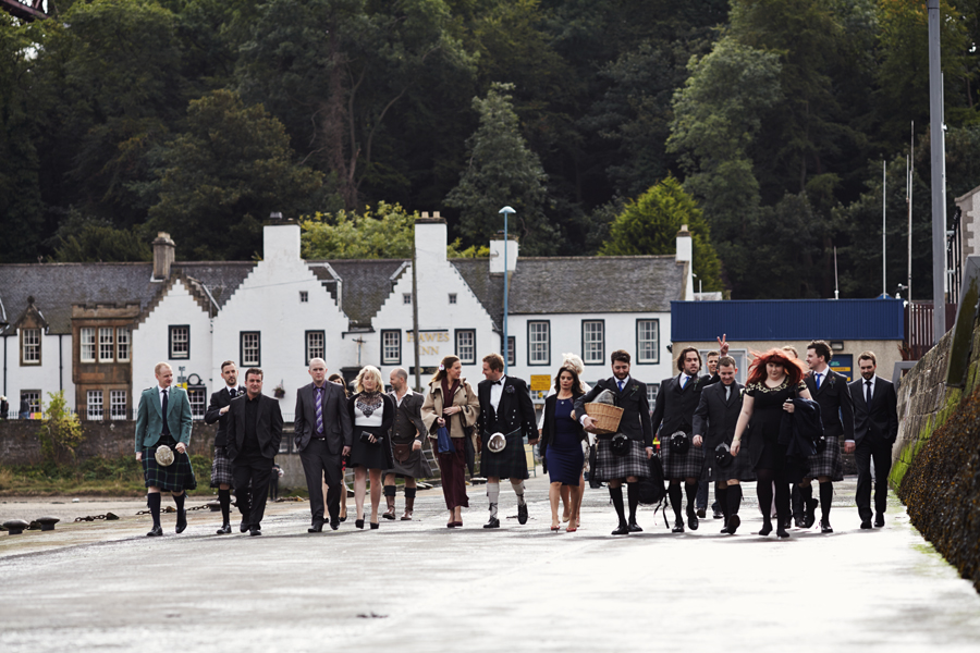 Groom walking with his crew in South Queensferry