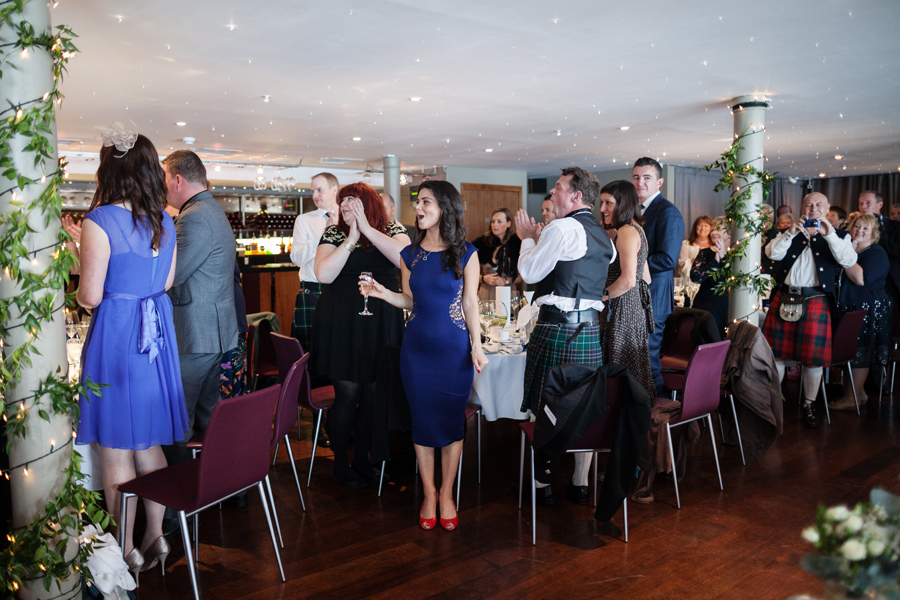 Wedding guests cheering for the couple in Orocco Pier