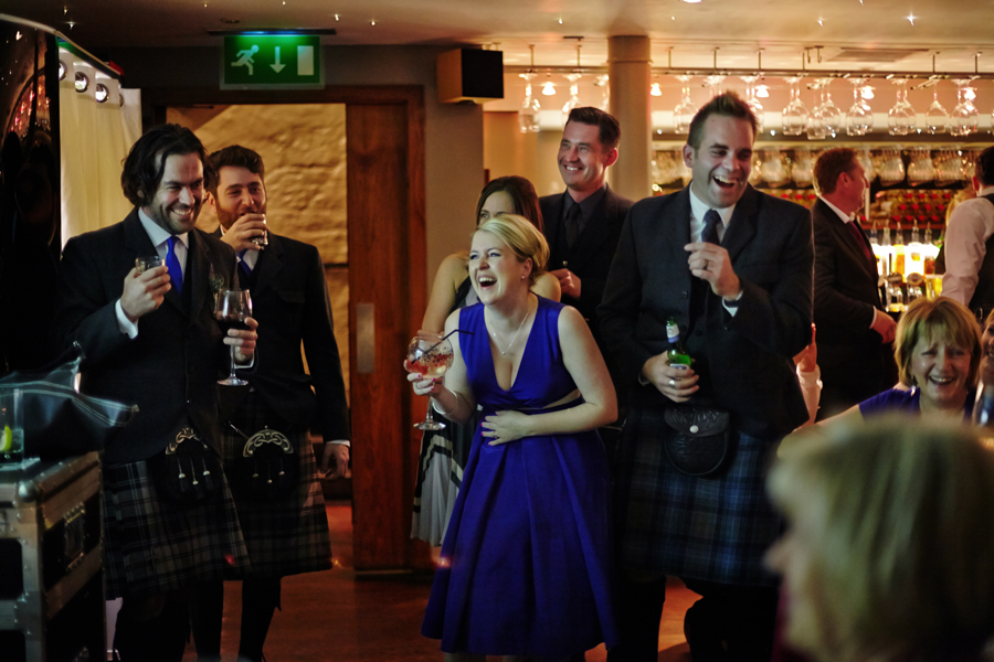 Wedding guests having fun during wedding reception at Orocco Pier in South Queensferry