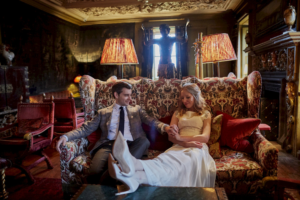 Happy couple on the sofa in Prestonfield House Hotel Edinburgh