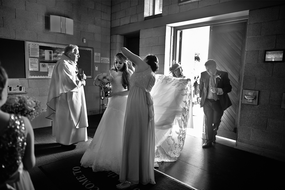 Bride entering the church ceremony in Glasgow - documentary wedding photography in Scotland