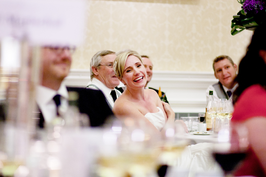 Bride laughing during specches at Merchant's Hall in Edinburgh
