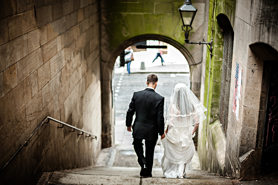 Bride and groom in one of the Royal Mile closes