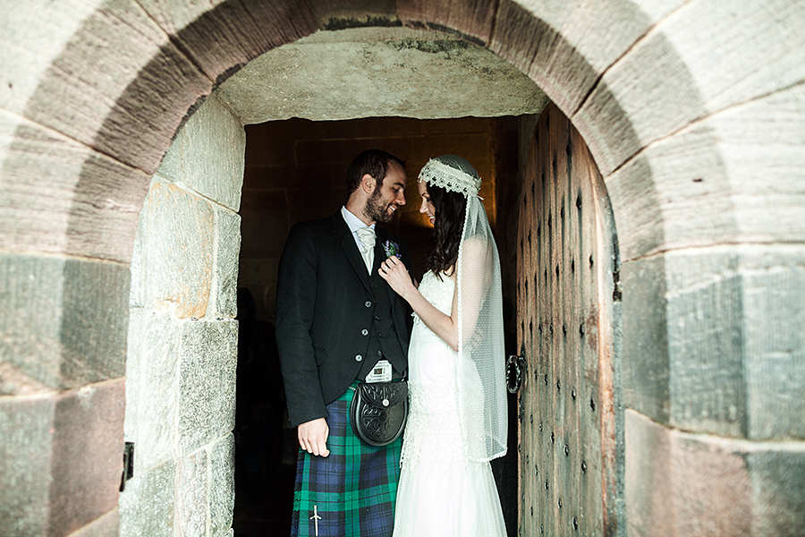 Married couple at Edinburgh Castle after the wedding ceremony