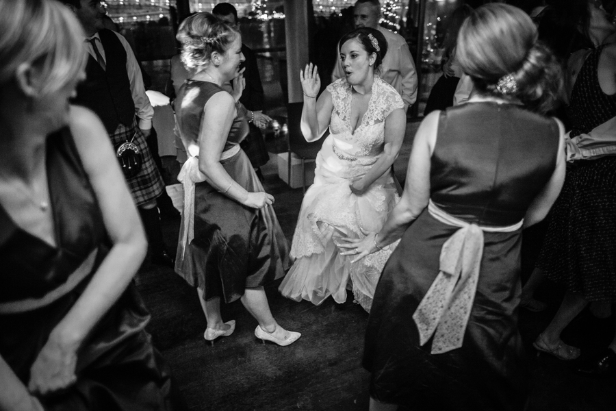 Bride and her bridesmaids having fun on the dance floor at Orocco Pier