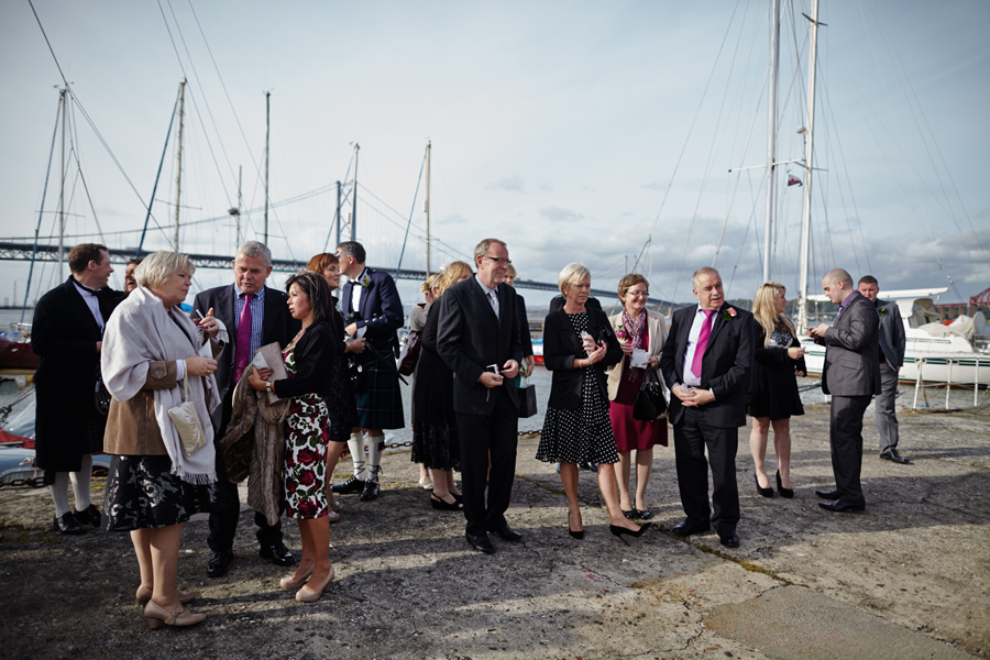 Wedding guests waiting for the couple at Orocco Pier in South Queensferry