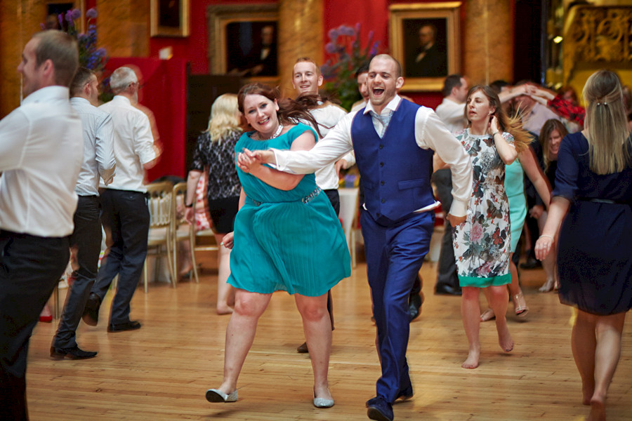 Photos of dancing wedding quests at civil partnership at Royal College of Physicians in Edinburgh