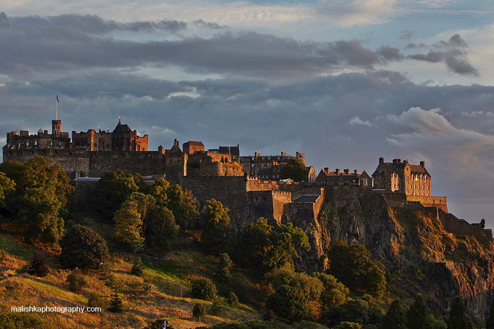 Edinburgh Castle illuminated by the light of setting sun