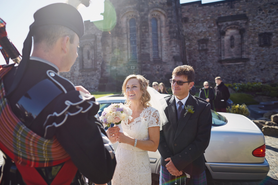Piper greeting the bride at Edinburgh Castle wedding