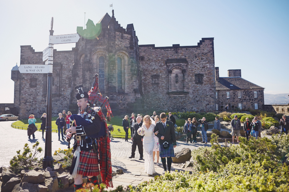 Scottish piper walking the bride for Edinburgh Castle wedding ceremony
