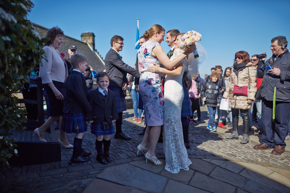 Guests and happy couple after the Edinburgh Castle wedding ceremony