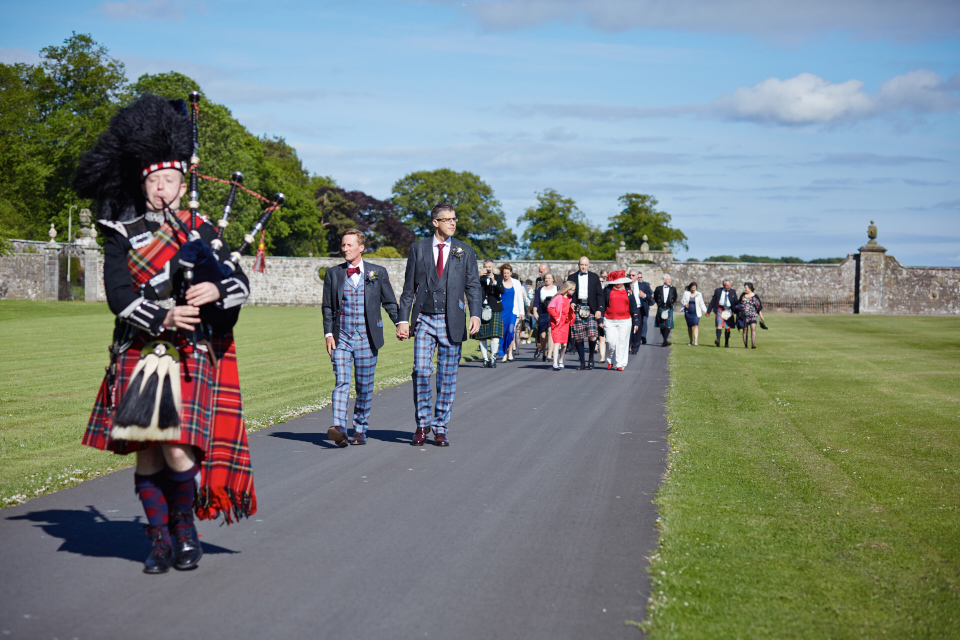 on the way to the wedding reception with a piper at Kinross House