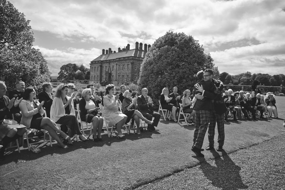 Two grooms wedding ceremony at Kinross House gardens