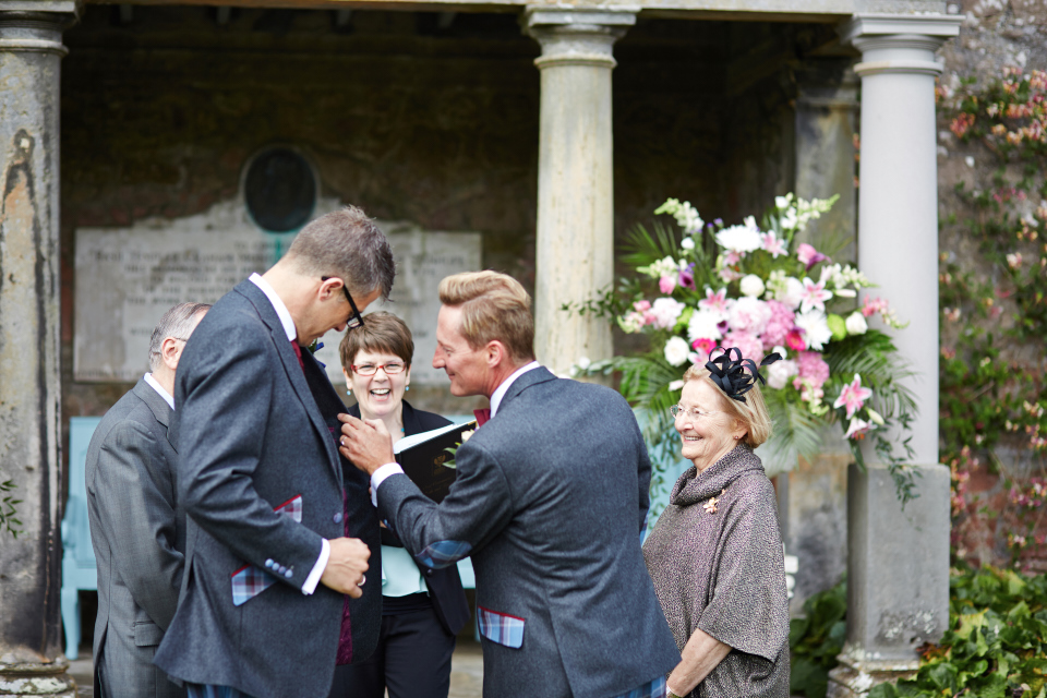 Two grooms wedding ceremony at Kinross House gardens